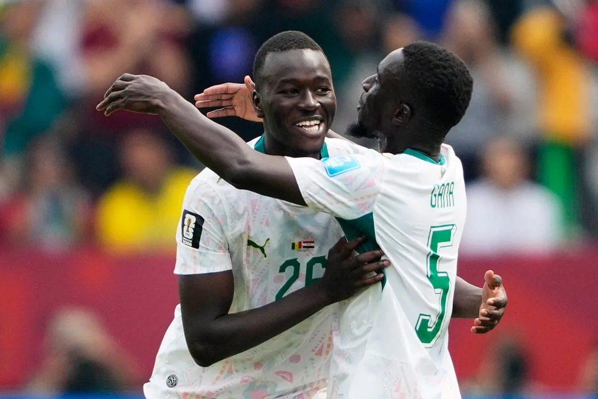 Senegal salvage hopes of World Cup last-32 place with rout of 10-man Iraq