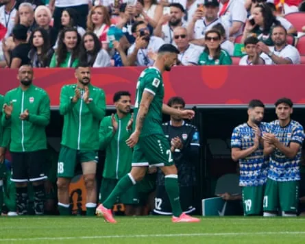 Iraq’s Rebin Sulaka walks off the pitch in front of his teammates after being sent off against Senegal.