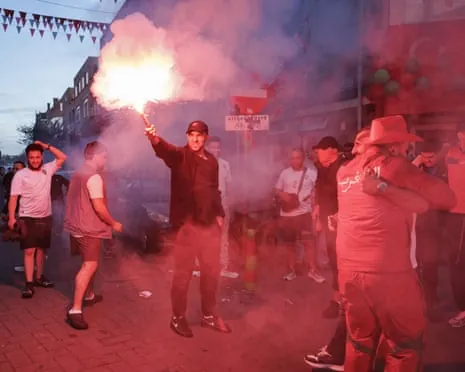 Moroccan fans celebrate in The Hague after the team’s World Cup victory over the Netherlands.