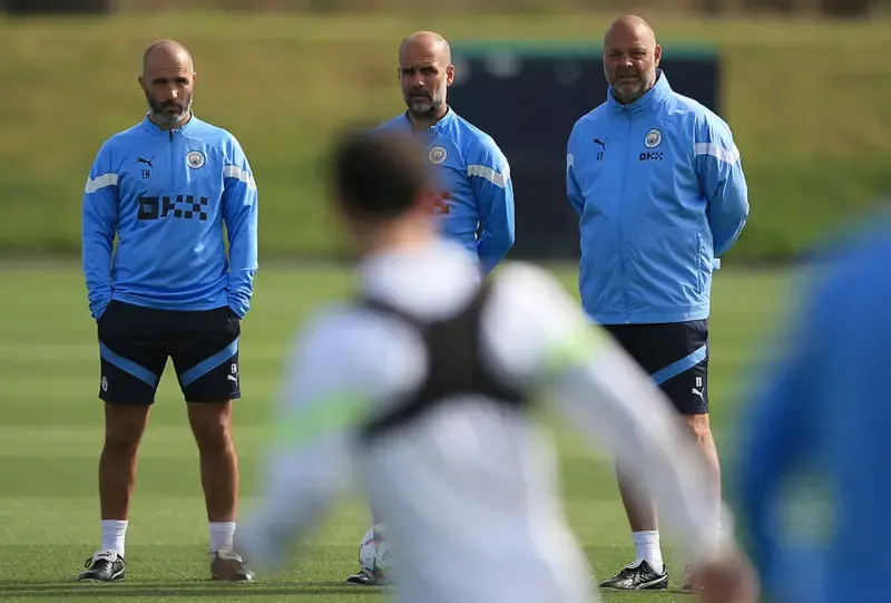 Pep Guardiola and assistant Enzo Maresca oversee Manchester City training before a Champions League match in 2022