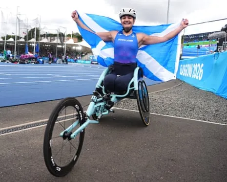 Melanie Woods of Scotland celebrates winning gold in the women’s 1500m T54 final re-run at Scotstoun Stadium