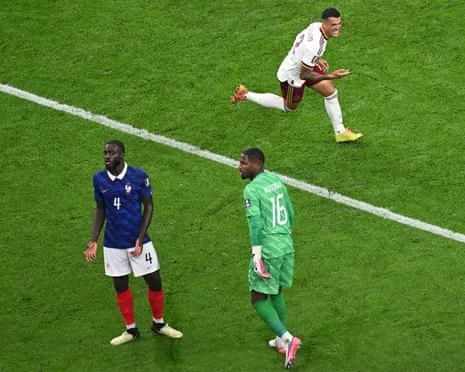 Pedro Porro turns to celebrate making it 2-0 as Mike Maignan and Dayot Upamecano despair