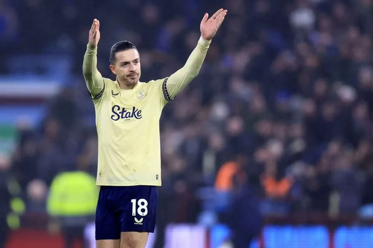 Jack Grealish acknowledges the Holte End during an Aston Villa vs Everton game