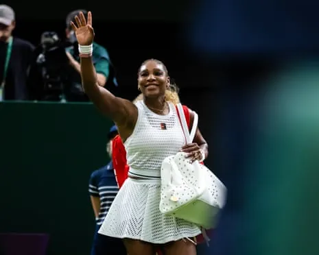 Serena Williams waves to fans