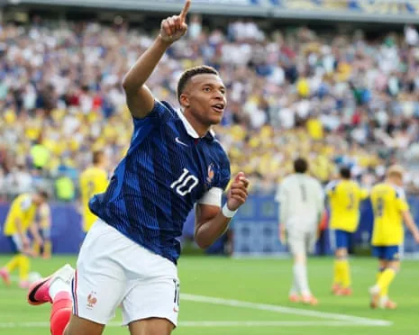 Kylian Mbappé celebrates after slotting home France’s third goal in a dominant display