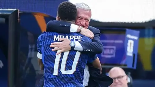 Kylian Mbappe #10 of France celebrates with Didier Deschamps, Head Coach of France, after scoring the team's first goal during the FIFA World Cup 2026 Round Of 32 match between France and Sweden.