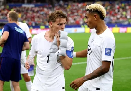 Martin Ødegaard and Antonio Nusa speak during a hydration break during the match against Côte d’Ivoire.