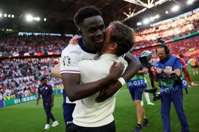 Gareth Southgate embraces Bukayo Saka after England beat Switzerland in the Euro 2024 quarter-finals