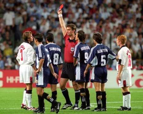 England’s David Beckham (left) is shown red by the Danish referee Kim Milton Nielsen